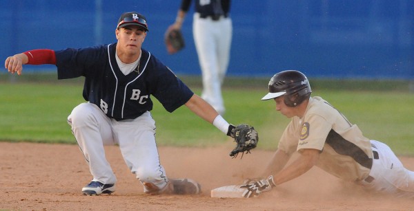 Bangor Comrade Nick Cota swings a gloved ball at Brewer Falcon Schyuler Van Der Eb during second inning action at second base at Mansfield Stadium on Monday, July 9, 2012. Van DerEb was ruled safe. Bangor Comrade Nick Cota swings a gloved ball at Brewer Falcon Schyuler Van Der Eb during second inning action at second base at Mansfield Stadium on Monday, July 9, 2012. Van DerEb was ruled safe.