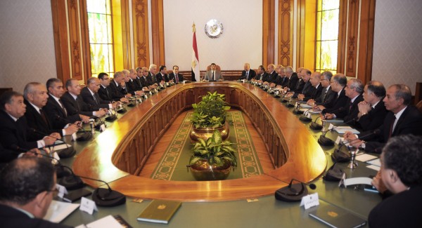 Newly elected President Mohammed Morsi (center) meets with government ministers at the presidential palace in Cairo, Egypt, Monday, July 2, 2012. Newly elected President Mohammed Morsi (center) meets with government ministers at the presidential palace in Cairo, Egypt, Monday, July 2, 2012.