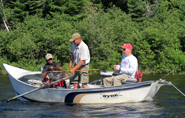 U.S. Army Sgt. Tim Pierre of Oakland, Calif., holds up a landlocked salmon as guide Chad Cray (center) and Army Capt. Stan Wells, of Baxter Springs, Kan., look on during a drift boat trip on the East Outlet of the Kennebec River on Wednesday, July 11, 2012. Five soldiers who are receiving treatment at Walter Reed Army Medical Center were in Maine for three days of fishing as a part of a Wounded Warrior Outdoors trip. U.S. Army Sgt. Tim Pierre of Oakland, Calif., holds up a landlocked salmon as guide Chad Cray (center) and Army Capt. Stan Wells, of Baxter Springs, Kan., look on during a drift boat trip on the East Outlet of the Kennebec River on Wednesday, July 11, 2012. Five soldiers who are receiving treatment at Walter Reed Army Medical Center were in Maine for three days of fishing as a part of a Wounded Warrior Outdoors trip.