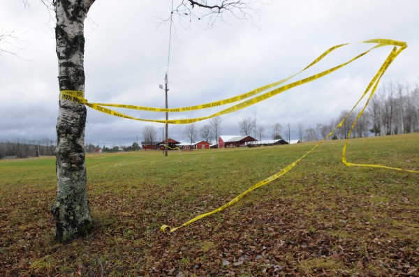 Crime scene tape flies in the wind at the Piscatiquis Valley Fairgrounds in November 2011. Michael Curtis was gunned down by police at this location after shooting and killling Udo Schneider only moments earlier. Crime scene tape flies in the wind at the Piscatiquis Valley Fairgrounds in November 2011. Michael Curtis was gunned down by police at this location after shooting and killling Udo Schneider only moments earlier.