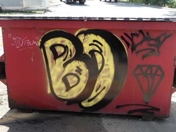 A stylized graffiti diamond and the initials "B.D." are spray-painted on a Dumpster at Emerson Energy Fuels in Ellsworth on July 16, 2012. Police have issued a summons to a 15-year-old Ellsworth boy in connection with the spate of diamond vandalism around the city in recent weeks. A stylized graffiti diamond and the initials "B.D." are spray-painted on a Dumpster at Emerson Energy Fuels in Ellsworth on July 16, 2012. Police have issued a summons to a 15-year-old Ellsworth boy in connection with the spate of diamond vandalism around the city in recent weeks.