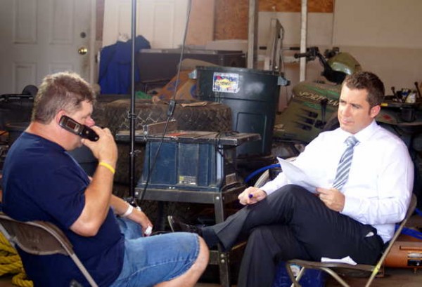 Redneck "Blank" organizer Harold Brooks, left, prepares for an interview with "The Daily Show" correspondent Jason Jones, who promised "NBC-style" coverage of this weekend's games, including bobbing for pigs' feet and beer-chugging. The episode likely will air Thursday night. Redneck "Blank" organizer Harold Brooks, left, prepares for an interview with "The Daily Show" correspondent Jason Jones, who promised "NBC-style" coverage of this weekend's games, including bobbing for pigs' feet and beer-chugging. The episode likely will air Thursday night.