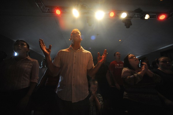 Pastor Kirk Winters (center) prays with his fellow worshipers Sunday morning, Aug. 12, 2012. Pastor Kirk Winters (center) prays with his fellow worshipers Sunday morning, Aug. 12, 2012.