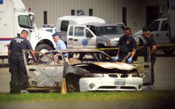 Police check a vehicle that was found burning at about 3:35 a.m. Monday. Police check a vehicle that was found burning at about 3:35 a.m. Monday.