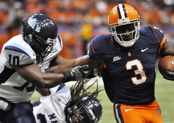 Maine linebacker Donte Dennis (left) tackles Syracuse’s Delone Carter during a game two seasons ago. After missing last season due to injury, Dennis returns this season to lead the Maine defense. Maine linebacker Donte Dennis (left) tackles Syracuse’s Delone Carter during a game two seasons ago. After missing last season due to injury, Dennis returns this season to lead the Maine defense.