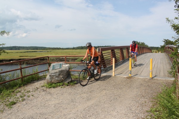 Marjorie Foote and Philip McGranahan of Kittery bike through Scarborough Marsh on Aug. 14, 2012, as they follow the East Coast Greenway from Portland to Saco. Marjorie Foote and Philip McGranahan of Kittery bike through Scarborough Marsh on Aug. 14, 2012, as they follow the East Coast Greenway from Portland to Saco.