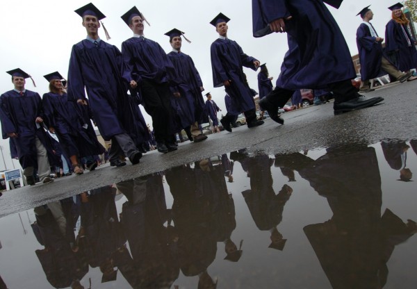 Sidestepping puddles, students march to Alfond Arena to receive their degrees during commencement exercises at the University of Maine in Orono in May. Sidestepping puddles, students march to Alfond Arena to receive their degrees during commencement exercises at the University of Maine in Orono in May.