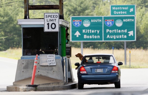 A motorist and her dog wait for change at a toll booth, Thursday, July 19, 2012, in Biddeford, Maine. A motorist and her dog wait for change at a toll booth, Thursday, July 19, 2012, in Biddeford, Maine.