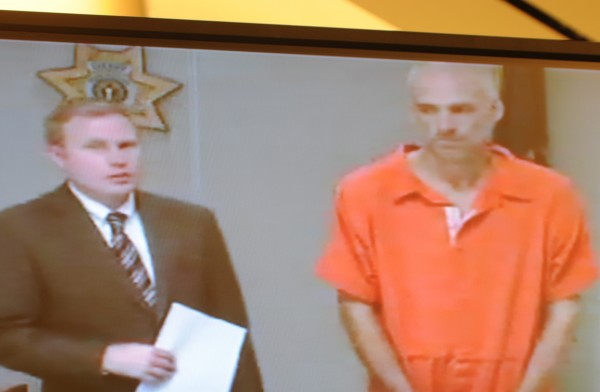 Brian Swett (right) stands with attorney Aaron Frey during his video initial appearance in court on Monday, Aug. 27, 2012 on charges of carjacking and robbery that ended with a high-speed chase and car crash along Interstate 95 on Friday. Brian Swett (right) stands with attorney Aaron Frey during his video initial appearance in court on Monday, Aug. 27, 2012 on charges of carjacking and robbery that ended with a high-speed chase and car crash along Interstate 95 on Friday.