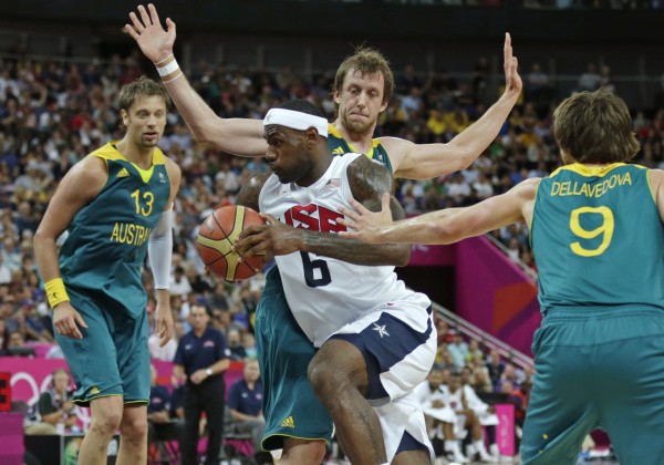 USA's LeBron James (6) drives to the basket against Australia during a men's quarterfinals basketball game at the 2012 Summer Olympics, Wednesday, Aug. 8, 2012, in London. From left are Australia's David Andersen, Matt Nielsen and Matt Dellavedova. USA's LeBron James (6) drives to the basket against Australia during a men's quarterfinals basketball game at the 2012 Summer Olympics, Wednesday, Aug. 8, 2012, in London. From left are Australia's David Andersen, Matt Nielsen and Matt Dellavedova.