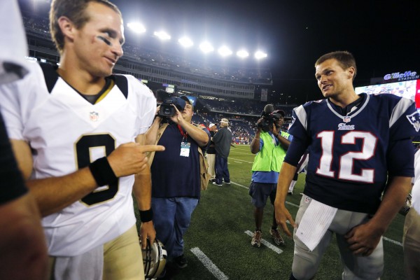 New Orleans Saints quarterback Drew Brees (9) points at New England Patriots quarterback Tom Brady (12) after the Patriots defeated the Saints 7-6 in an NFL preseason football game in Foxborough, Mass., Thursday, Aug. 9, 2012. New Orleans Saints quarterback Drew Brees (9) points at New England Patriots quarterback Tom Brady (12) after the Patriots defeated the Saints 7-6 in an NFL preseason football game in Foxborough, Mass., Thursday, Aug. 9, 2012.
