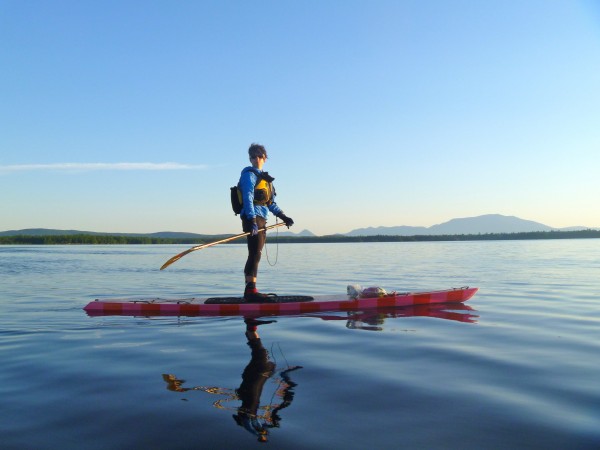 Bar Harbor native Amanda James crosses Upper Jo Mary Lake on her handcrafted wooden stand-up paddle board in mid-July 2012. Bar Harbor native Amanda James crosses Upper Jo Mary Lake on her handcrafted wooden stand-up paddle board in mid-July 2012.