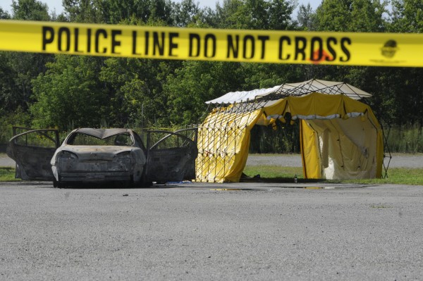 Police mobile crime vehicles were gone Tuesday morning, Aug. 14, 2012, but Bangor police still had the area secured with yellow crime tape. Police mobile crime vehicles were gone Tuesday morning, Aug. 14, 2012, but Bangor police still had the area secured with yellow crime tape.
