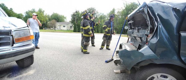 The driver of this truck (left) looks at the damage to a vehicle he collided with while the driver was waiting to make a left turn onto Lake Shore Drive in Auburn Monday evening. The driver of this truck (left) looks at the damage to a vehicle he collided with while the driver was waiting to make a left turn onto Lake Shore Drive in Auburn Monday evening.
