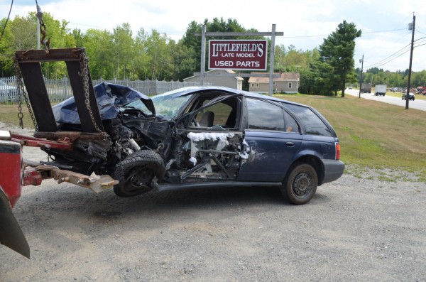 A Saturn station wagon is hooked to the back of a tow truck after being involved in a three-vehicle crash on Route 7 in Corinna on Thursday, Aug. 9, 2012. A Saturn station wagon is hooked to the back of a tow truck after being involved in a three-vehicle crash on Route 7 in Corinna on Thursday, Aug. 9, 2012.