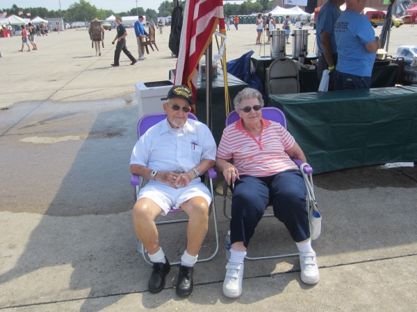 Harry Dixon, 89, and his friend, Thelma Lever, both of Lewiston, sit Saturday morning, Aug. 25, 2012 in the shade of an American Legion booth to watch Randy Harris maneuver his Skybolt 300 over the runway of the former Brunswick Naval Air Station during the 2012 Great State of Maine Air Show. Harry Dixon, 89, and his friend, Thelma Lever, both of Lewiston, sit Saturday morning, Aug. 25, 2012 in the shade of an American Legion booth to watch Randy Harris maneuver his Skybolt 300 over the runway of the former Brunswick Naval Air Station during the 2012 Great State of Maine Air Show.
