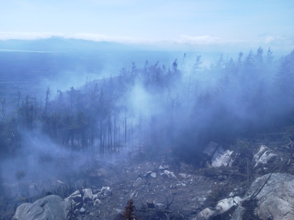 Maine Forest Rangers and other emergency workers battle a wildfire covering about two acres on top of Big Spencer Mountain in Piscataquis County on Sunday, Aug. 5, 2012. Maine Forest Rangers and other emergency workers battle a wildfire covering about two acres on top of Big Spencer Mountain in Piscataquis County on Sunday, Aug. 5, 2012.