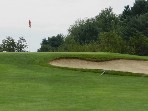 Reaching the green of the par-3 fourth hole at Mere Creek Golf Course can present a challenge for golfers. With a 149-yard uphill tee shot, players should try and avoid falling short of the green with the bunker in front Reaching the green of the par-3 fourth hole at Mere Creek Golf Course can present a challenge for golfers. With a 149-yard uphill tee shot, players should try and avoid falling short of the green with the bunker in front