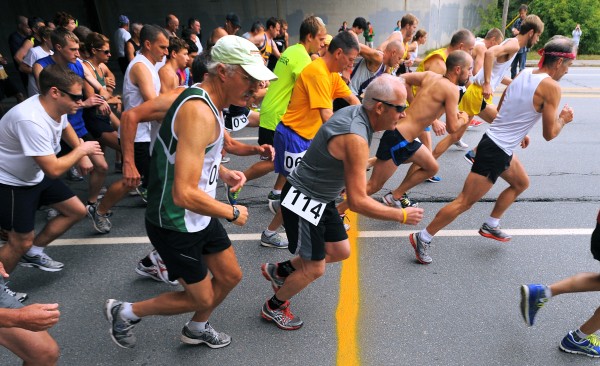 Competitiors take off at the start of the 50th annual 5-mile Labor Day Road Race in Bangor on Monday. It was the last time the current course will be used. Competitiors take off at the start of the 50th annual 5-mile Labor Day Road Race in Bangor on Monday. It was the last time the current course will be used.