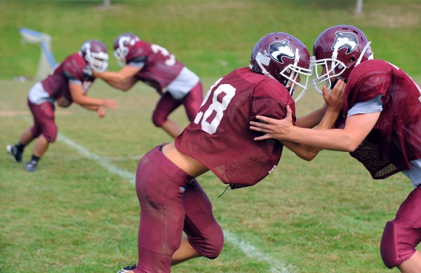 The Maine Central Institute Huskies run defensive drills during a recent practice. The Huskies will battle for a playoff berth again this season. The Maine Central Institute Huskies run defensive drills during a recent practice. The Huskies will battle for a playoff berth again this season.