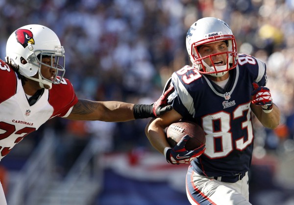 New England Patriots wide receiver Wes Welker (83) runs the ball against Arizona Cardinals cornerback Jamell Fleming during the second half at Gillette Stadium in Foxborough, Mass., on Sept. 16, 2012. New England Patriots wide receiver Wes Welker (83) runs the ball against Arizona Cardinals cornerback Jamell Fleming during the second half at Gillette Stadium in Foxborough, Mass., on Sept. 16, 2012.
