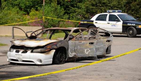 A burned-out car with three bodies inside was found in Target Industrial Circle in Bangor on Monday, Aug. 13, 2012. A burned-out car with three bodies inside was found in Target Industrial Circle in Bangor on Monday, Aug. 13, 2012.