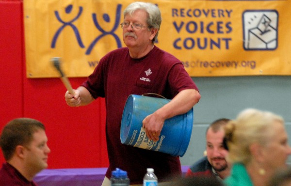 Bruce Campbell, clinical director of Wellspring, beats on a bucket during a drumming circle to introduce the Bangor Area Recovery Network's fifth annual summit on addiction recovery at the Brewer Auditorium on Wednesday morning, Sept. 26, 2012. The purpose of the summit is to "stimulate public visibility and show that people do recover," said Campbell.
Bruce Campbell, clinical director of Wellspring, beats on a bucket during a drumming circle to introduce the Bangor Area Recovery Network's fifth annual summit on addiction recovery at the Brewer Auditorium on Wednesday morning, Sept. 26, 2012. The purpose of the summit is to "stimulate public visibility and show that people do recover," said Campbell.