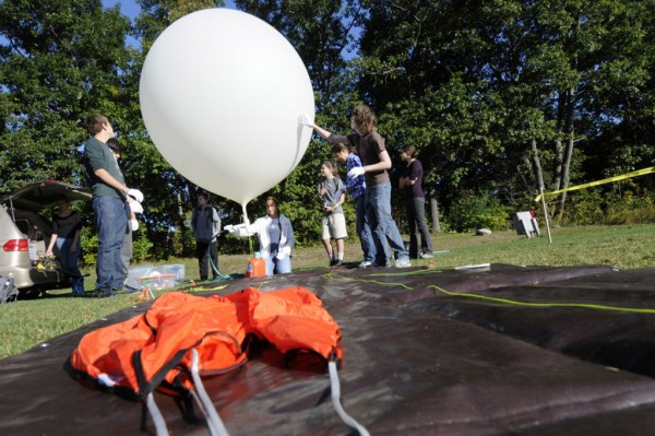 Bangor High School STEM program students carefully prepare their weather balloon for launch from Bangor High School's soccer field Thursday morning, Sept. 27, 2012. Bangor High School STEM program students carefully prepare their weather balloon for launch from Bangor High School's soccer field Thursday morning, Sept. 27, 2012.