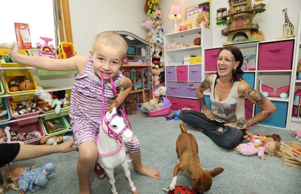 Five-year-old Danika DeMayo enjoys some playtime with her mother, Amy Liberman of Woodstock, on Sunday. Danika was seriously injured in an accident last month when the car driven by her mother was struck from behind. Danika suffered skull fractures and was in a coma as a result. Five-year-old Danika DeMayo enjoys some playtime with her mother, Amy Liberman of Woodstock, on Sunday. Danika was seriously injured in an accident last month when the car driven by her mother was struck from behind. Danika suffered skull fractures and was in a coma as a result.