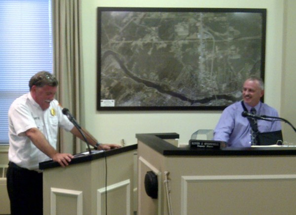 Fire Chief Gary Parent (left) turns red and holds onto the lectern while reading a fake City Council resolve on Sept. 11, 2012 that jokes about his 27 years with the Brewer Fire Department. Parent is retiring at the end of the month. Fire Chief Gary Parent (left) turns red and holds onto the lectern while reading a fake City Council resolve on Sept. 11, 2012 that jokes about his 27 years with the Brewer Fire Department. Parent is retiring at the end of the month.