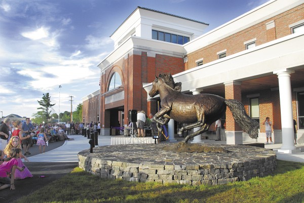 The new bronze sculpture of a galloping bronco is near the entrance to the new Hampden Academy. Sculptor Forest Hart involved SAD 22 students in the sculpting process and paid for the endeavor with the sale of desktop replicas, making this bronco a true community project. The bronco echoes the original sculpture of a rearing bronco that has sat in front of the old Hampden Academy since 1992. The new bronze sculpture of a galloping bronco is near the entrance to the new Hampden Academy. Sculptor Forest Hart involved SAD 22 students in the sculpting process and paid for the endeavor with the sale of desktop replicas, making this bronco a true community project. The bronco echoes the original sculpture of a rearing bronco that has sat in front of the old Hampden Academy since 1992.