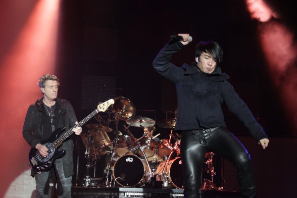 Bassist Ross Valory (from left), drummer Deen Castronovo and singer Arnel Pineda rock the crowd of more than 10,000 as Journey kept the Bangor Waterfront believing Friday night through the rain and the cold. Bassist Ross Valory (from left), drummer Deen Castronovo and singer Arnel Pineda rock the crowd of more than 10,000 as Journey kept the Bangor Waterfront believing Friday night through the rain and the cold.
