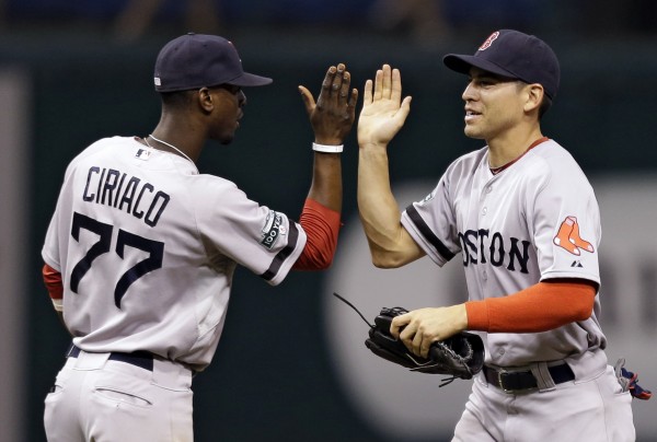 Boston Red Sox's Jacoby Ellsbury, right, high-fives teammate Pedro Ciriaco after the team defeated the Tampa Bay Rays 5-2 during a baseball game, Monday, Sept. 17, 2012, in St. Petersburg, Fla. Boston Red Sox's Jacoby Ellsbury, right, high-fives teammate Pedro Ciriaco after the team defeated the Tampa Bay Rays 5-2 during a baseball game, Monday, Sept. 17, 2012, in St. Petersburg, Fla.