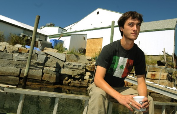 Kyle Murdock sits on a dock in front of the Sea Hag lobster processing plant he runs in St. George on Wednesday, Aug. 30, 2012. Kyle Murdock sits on a dock in front of the Sea Hag lobster processing plant he runs in St. George on Wednesday, Aug. 30, 2012.