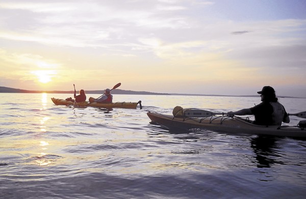 As her kayak tour group returned from a sunset kayak tour, Debra Bell photographed the August sun almost touching the Mount Desert Island horizon off Bar Harbor. As her kayak tour group returned from a sunset kayak tour, Debra Bell photographed the August sun almost touching the Mount Desert Island horizon off Bar Harbor.