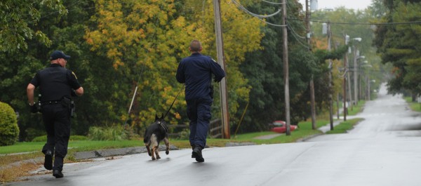 Police using a tracking dog run down Chamberlain Street in Brewer on Sunday, Sept. 30, 2012 after reports of an attempted robbery at Rite Aid on Wilson Street in Brewer. Police using a tracking dog run down Chamberlain Street in Brewer on Sunday, Sept. 30, 2012 after reports of an attempted robbery at Rite Aid on Wilson Street in Brewer.