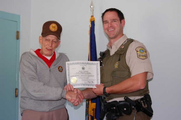 Franklin County Sheriff Dennis Pike, left, shakes hands with Andre Charland, a police officer with the Quebec Provincial Police, on Thursday after Pike appointed him an honorary sheriff's deputy. Franklin County Sheriff Dennis Pike, left, shakes hands with Andre Charland, a police officer with the Quebec Provincial Police, on Thursday after Pike appointed him an honorary sheriff's deputy.