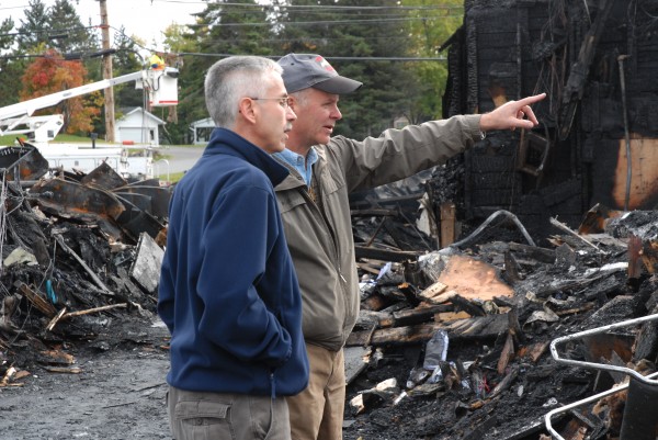 Carl Theriault (right), owner of Valley Auto, discusses the removal of waste oil from tanks with Burt Levesque of Daigle Oil Co. Theriault's business was destroyed in a fast-moving fire Wednesday, but thanks to a communitywide effort, most of his inventory, computers and files were saved. Valley Auto has reopened on a limited basis at Lonesome Pine Ski Lodge in Fort Kent. Carl Theriault (right), owner of Valley Auto, discusses the removal of waste oil from tanks with Burt Levesque of Daigle Oil Co. Theriault's business was destroyed in a fast-moving fire Wednesday, but thanks to a communitywide effort, most of his inventory, computers and files were saved. Valley Auto has reopened on a limited basis at Lonesome Pine Ski Lodge in Fort Kent.
