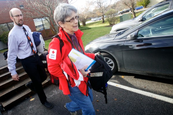 In Portland, American Red Cross Regional Director Jason Shedlock (left) helps volunteer nurse Bonnie MacInnis load her luggage into a car that will take her to New York on Wednesday, Oct. 31, 2012 where she'll help victims of Hurricane Sandy for the next few weeks. In Portland, American Red Cross Regional Director Jason Shedlock (left) helps volunteer nurse Bonnie MacInnis load her luggage into a car that will take her to New York on Wednesday, Oct. 31, 2012 where she'll help victims of Hurricane Sandy for the next few weeks.