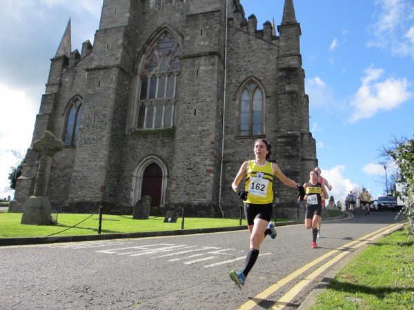 Down East native Gladys Ganiel runs past St. Patrick's Church in Downpatrick, Northern Ireland, on her way to winning the Jimmy's 10K Road Race in March. The church is the site of St. Patrick's grave. Down East native Gladys Ganiel runs past St. Patrick's Church in Downpatrick, Northern Ireland, on her way to winning the Jimmy's 10K Road Race in March. The church is the site of St. Patrick's grave.