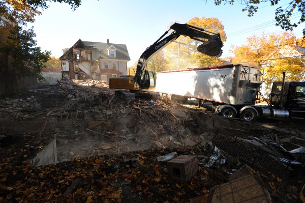 A crew from Gardner Construction of Hermon uses an excavator to demolish 16 Sanford Street in Bangor on Thursday, Oct. 25, 2012. Three other houses on that street were demolished Wednesday as part of a long-term expansion plan set forth by the Bangor Y. A crew from Gardner Construction of Hermon uses an excavator to demolish 16 Sanford Street in Bangor on Thursday, Oct. 25, 2012. Three other houses on that street were demolished Wednesday as part of a long-term expansion plan set forth by the Bangor Y.