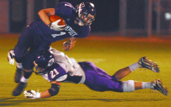 Hampden Academy's Benjamin Cambridge (left) is taken down by Waterville's Racean Wood (21) during second half action of playoff football at Hampden Academy Friday night Oct. 26 2012. Waterville knocked off Hampden 25-17. Hampden Academy's Benjamin Cambridge (left) is taken down by Waterville's Racean Wood (21) during second half action of playoff football at Hampden Academy Friday night Oct. 26 2012. Waterville knocked off Hampden 25-17.