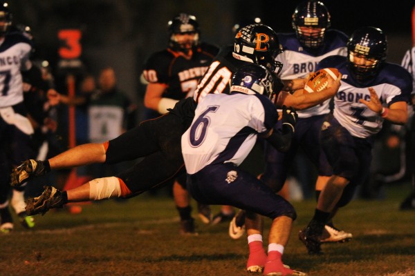 Brewer's Brody Valley leaps across the goal line during first quarter action against Hampden at Brewer on Friday, Oct. 19, 2012. Also in on the play is Hampden #6 Nick Rogerson, #3 Matt Haws, and #54 ( behind ball) Jeremy Kelsey. Brewer's Brody Valley leaps across the goal line during first quarter action against Hampden at Brewer on Friday, Oct. 19, 2012. Also in on the play is Hampden #6 Nick Rogerson, #3 Matt Haws, and #54 ( behind ball) Jeremy Kelsey.