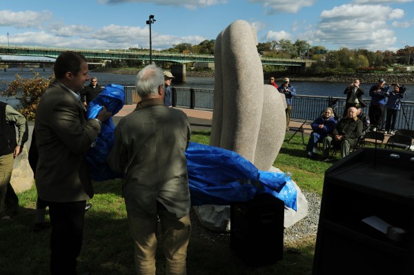 Bangor City Council Chairman Cary Weston (left) and John Rohman unveil a granite sculpture along the Bangor Waterfront on Thursday, Oct. 11, 2012. Artisit Koichi Ogino of Japan was selected from a group of eight that participated in the Schoodic International Sculpture Symposium to create the piece for Bangor. Bangor City Council Chairman Cary Weston (left) and John Rohman unveil a granite sculpture along the Bangor Waterfront on Thursday, Oct. 11, 2012. Artisit Koichi Ogino of Japan was selected from a group of eight that participated in the Schoodic International Sculpture Symposium to create the piece for Bangor.