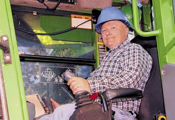 Brian Mack of Howland sits at the controls of a John Deere 753 feller-buncher equipped with a 22-inch Gilbert cutting head. He is cutting trees for Treeline Inc. at an Orville harvest site. Brian Mack of Howland sits at the controls of a John Deere 753 feller-buncher equipped with a 22-inch Gilbert cutting head. He is cutting trees for Treeline Inc. at an Orville harvest site.