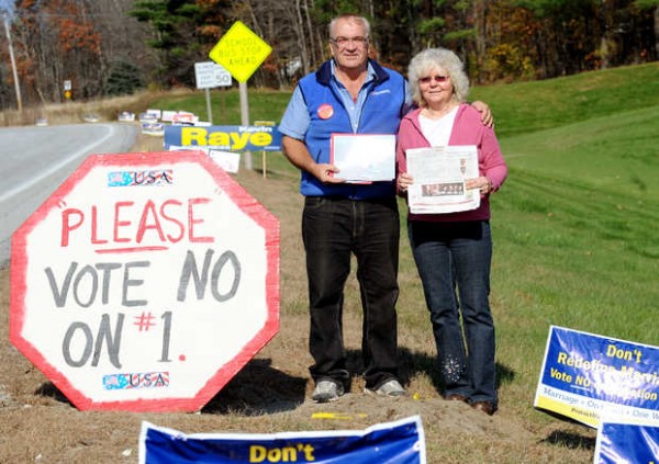 Wayne and Carolyn Viger hold a photo of the Statue of Liberty stolen from near the corner of Routes 4 and 117 and a newspaper with the message, "I guess Christians aren't moral after all!!!" The message was left sometime overnight Thursday. The couple, who have been married for 38 years and oppose gay marriage, erected the statue with "No on 1" signs 10 days ago. Question 1 on the Nov. 6 ballot would make same-sex marriage legal in Maine. Wayne and Carolyn Viger hold a photo of the Statue of Liberty stolen from near the corner of Routes 4 and 117 and a newspaper with the message, "I guess Christians aren't moral after all!!!" The message was left sometime overnight Thursday. The couple, who have been married for 38 years and oppose gay marriage, erected the statue with "No on 1" signs 10 days ago. Question 1 on the Nov. 6 ballot would make same-sex marriage legal in Maine.