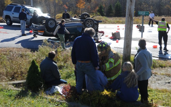 Local police and emergency response personnel attend to a two-vehicle accident that occurred early Tuesday afternoon, Oct. 23, 2012 at the corner of Thorsen Road and Route 1 in Hancock. At least two occupants sustained injuries. One of the vehicles came to a rest on its top. Local police and emergency response personnel attend to a two-vehicle accident that occurred early Tuesday afternoon, Oct. 23, 2012 at the corner of Thorsen Road and Route 1 in Hancock. At least two occupants sustained injuries. One of the vehicles came to a rest on its top.