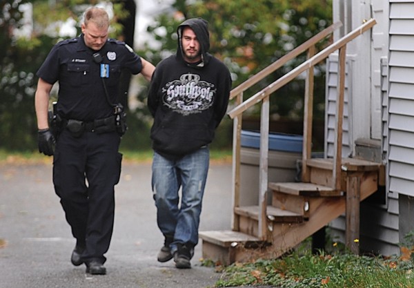 Bangor police officer Jason Stuart takes Kirk DePhilippo into custody around noontime Monday, Oct. 15, 2012, for his alleged role in a pharmacy robbery in Bangor. Bangor police officer Jason Stuart takes Kirk DePhilippo into custody around noontime Monday, Oct. 15, 2012, for his alleged role in a pharmacy robbery in Bangor.