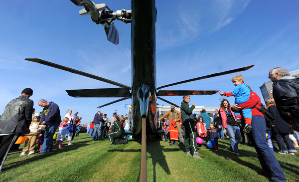 Children and adults check out the Life Flight of Maine helicopter that landed during the Trucks and Treats event at the Lafayette Family Cancer Care of Maine building in Brewer Saturday. Children and adults check out the Life Flight of Maine helicopter that landed during the Trucks and Treats event at the Lafayette Family Cancer Care of Maine building in Brewer Saturday.