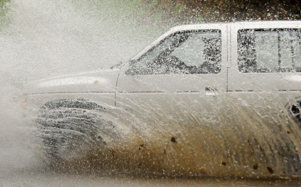 A car drives through floodwater on Broadway in Bangor after heavy rains caused flooding and washed out some roads in the region on Saturday, Oct. 20, 2012. A car drives through floodwater on Broadway in Bangor after heavy rains caused flooding and washed out some roads in the region on Saturday, Oct. 20, 2012.